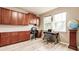 Home office with built-in cabinetry and wood floors at 30120 Hackney Loop, Mount Dora, FL 32757
