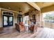 Cozy outdoor patio with fireplace and seating at 30120 Hackney Loop, Mount Dora, FL 32757