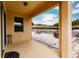 Covered patio with paver stones, outdoor seating, and backyard access at 30120 Hackney Loop, Mount Dora, FL 32757