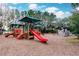 Community playground with climbing structures and slides at 30120 Hackney Loop, Mount Dora, FL 32757