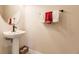 Clean powder room with pedestal sink and modern fixtures at 30120 Hackney Loop, Mount Dora, FL 32757
