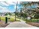 Paved walking path with benches and pet water fountain at 30120 Hackney Loop, Mount Dora, FL 32757