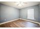 Simple bedroom with light walls and wood flooring at 388 Hampton Hills Ct, Debary, FL 32713