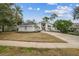 House exterior featuring a two-car garage and manicured lawn at 388 Hampton Hills Ct, Debary, FL 32713