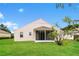 House exterior showcasing a screened porch and grassy yard at 5634 Moon Valley Dr, Lakeland, FL 33812