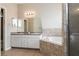 Bathroom boasts double vanity, corner tub, and shower at 5634 Moon Valley Dr, Lakeland, FL 33812