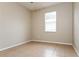 Well-lit bedroom with tile flooring and window with blinds at 5634 Moon Valley Dr, Lakeland, FL 33812