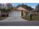 House exterior showcasing a driveway and front yard at 2325 Paulette Dr, Haines City, FL 33844