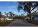 Quiet residential street with mature trees at 2325 Paulette Dr, Haines City, FL 33844