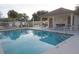 Community pool with adjacent restrooms and lounge chairs at 2325 Paulette Dr, Haines City, FL 33844