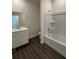 Well-lit bathroom features a shower-tub combo and modern sink vanity at 4275 Sw 106Th Pl, Ocala, FL 34476