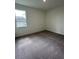 Bedroom featuring a window and neutral carpeting at 4275 Sw 106Th Pl, Ocala, FL 34476