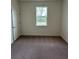 Cozy bedroom with a closet and a bright window overlooking the yard at 4275 Sw 106Th Pl, Ocala, FL 34476