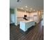 Spacious kitchen with center island, white cabinets, and modern appliances at 4275 Sw 106Th Pl, Ocala, FL 34476