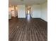 Open living space showcases modern flooring and access to other rooms at 4275 Sw 106Th Pl, Ocala, FL 34476