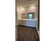 Bright bathroom with double sinks and a large mirror at 4275 Sw 106Th Pl, Ocala, FL 34476