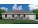 Charming single-story home with a well-manicured lawn, lovely landscaping, and attached two-car garage at 17085 Sw 40Th Ter, Ocala, FL 34473