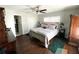 Spacious bedroom with wood floors, ceiling fan, closet, and ample natural light at 1223 Lawrence Ave, Deltona, FL 32725
