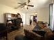 Spacious living room with wood floors and comfortable sofa with decorative pillows at 1223 Lawrence Ave, Deltona, FL 32725