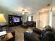 Inviting living room with new flooring, ceiling fan, comfortable furniture, and great natural light at 1223 Lawrence Ave, Deltona, FL 32725