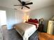 Comfortable main bedroom with wood floors, queen bed, and closet at 1223 Lawrence Ave, Deltona, FL 32725