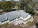 The home's rear exterior features a stone patio and walkway, perfect for outdoor entertaining at 1223 Lawrence Ave, Deltona, FL 32725