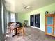 Bright sunroom with tile flooring, ample seating, and natural light at 1223 Lawrence Ave, Deltona, FL 32725