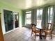 Enclosed sunroom with tile flooring, sliding doors, and plenty of natural light at 1223 Lawrence Ave, Deltona, FL 32725