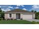 Charming single-story home featuring a two-car garage, stone accents, manicured lawn, and neutral color palette at 431 Lark Ct, Poinciana, FL 34759