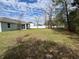 Large backyard with a privacy fence, mature trees and lush green grass at 5640 Sw 117Th Lane Rd, Ocala, FL 34476