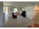 Open living room features tiled floors, neutral paint and sliding door to the backyard at 5640 Sw 117Th Lane Rd, Ocala, FL 34476