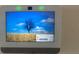 A mounted smart home device showing a peaceful nature scene and a pending update message at 999 Brooklet Dr, Davenport, FL 33837