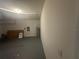 Spacious garage interior with painted floor, water heater, and ample space for parking and storage at 999 Brooklet Dr, Davenport, FL 33837