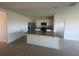 Open-concept kitchen with granite island, stainless steel appliances, and ample cabinet space, great for cooking at 999 Brooklet Dr, Davenport, FL 33837