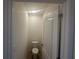A compact toilet with a white door and bright lighting at 999 Brooklet Dr, Davenport, FL 33837