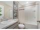 Modern bathroom featuring a gray vanity, a combined shower and tub and white tile at 1840 India Palm Dr, Edgewater, FL 32141