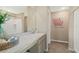 A well-lit bathroom featuring a large mirror, vanity with modern fixtures, and stylish decor at 1840 India Palm Dr, Edgewater, FL 32141