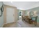 Stylish dining room with wood table, decor, and plenty of natural light at 1840 India Palm Dr, Edgewater, FL 32141
