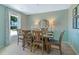 Bright dining room features a wooden table and chairs, with views from the window at 1840 India Palm Dr, Edgewater, FL 32141