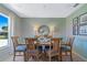 Dining area with seating for six, features stylish decor and natural light at 1840 India Palm Dr, Edgewater, FL 32141