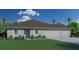 Charming single-story home features a well-manicured lawn, neutral color palette, and three-car garage at 1840 India Palm Dr, Edgewater, FL 32141