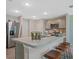 Modern kitchen boasts stainless steel appliances, ample counter space, and a convenient breakfast bar at 1840 India Palm Dr, Edgewater, FL 32141