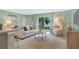 Cozy living room with a comfortable sofa, modern decor, and sliding glass doors to the backyard at 1840 India Palm Dr, Edgewater, FL 32141