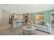 Inviting living room showcases a contemporary design with a breakfast bar and comfortable seating arrangement at 1840 India Palm Dr, Edgewater, FL 32141