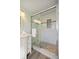 Modern bathroom featuring a tiled shower with a glass door and a stylish vanity at 906 Beechwood Ave, Lady Lake, FL 32159