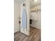 Functional walk-in closet with ample storage space and modern wood-look floors for organization at 906 Beechwood Ave, Lady Lake, FL 32159