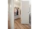 Bedroom closet with hanging clothes and luxury vinyl floors at 906 Beechwood Ave, Lady Lake, FL 32159