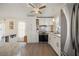 Updated kitchen featuring stainless steel appliances, wood-look floors, and modern white cabinets at 906 Beechwood Ave, Lady Lake, FL 32159
