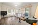 Inviting living room featuring natural light and a sliding door leading to the outdoor space at 906 Beechwood Ave, Lady Lake, FL 32159