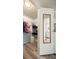 Walk-in closet with wire shelving and luxury vinyl floors provides ample storage at 906 Beechwood Ave, Lady Lake, FL 32159